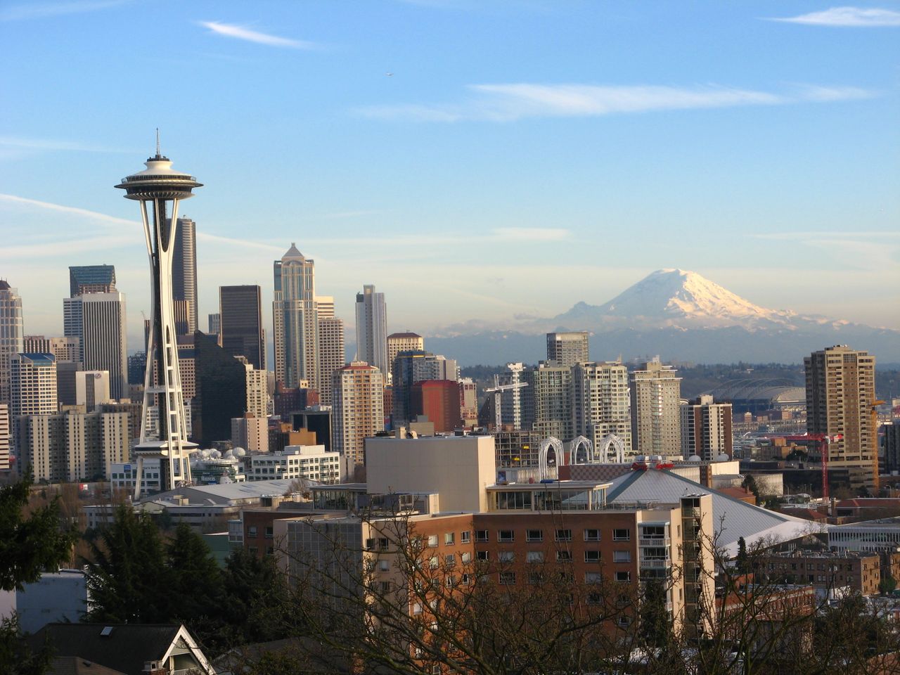 Stunning view of Seattle skyline featuring the Space Needle and Mount Rainier.